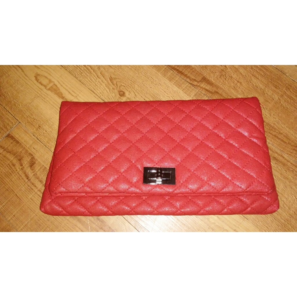 red quilted clutch bag .